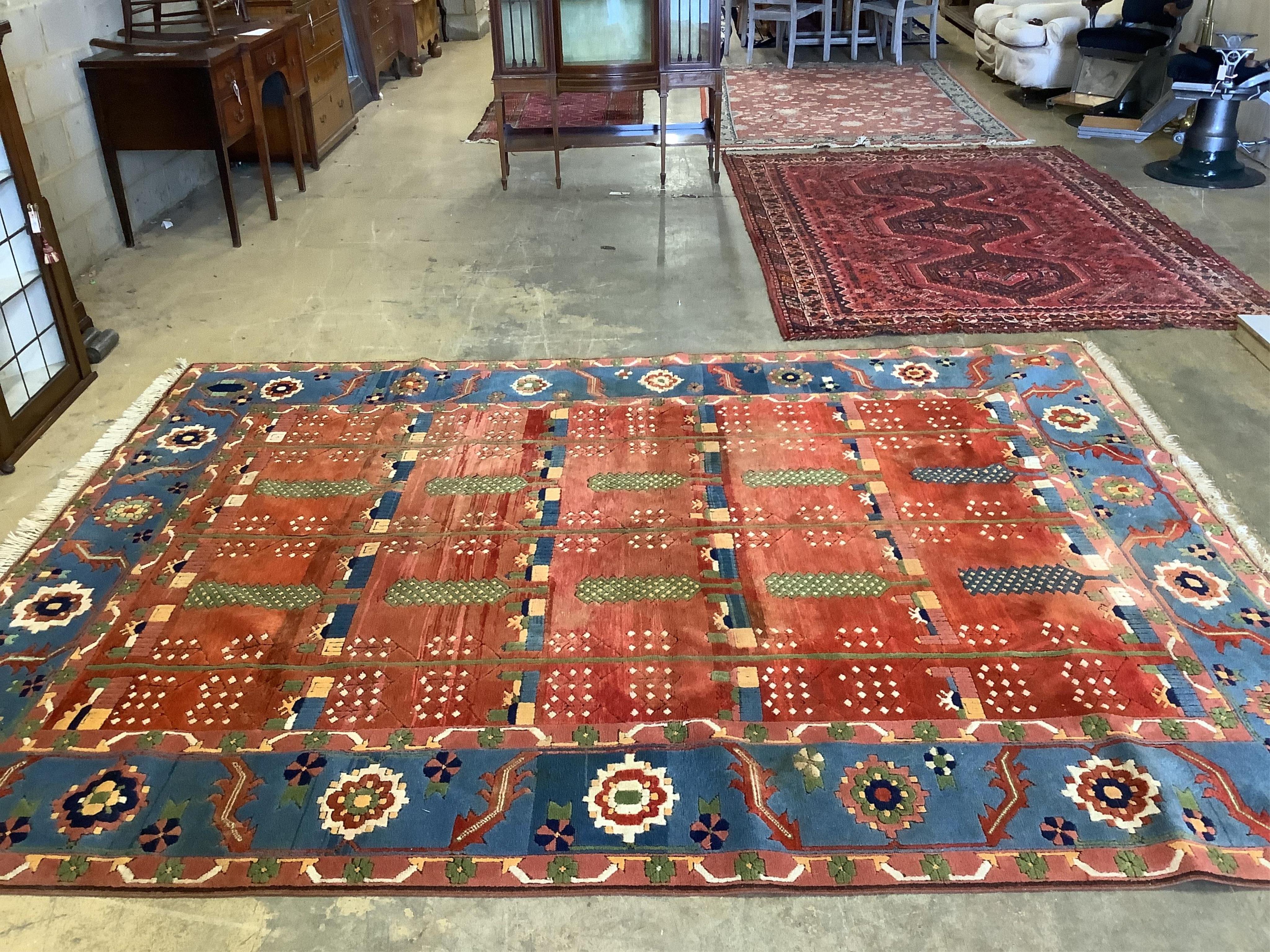 A modern Caucasian red ground carpet, 335 x 252cm. Condition - looks good but needs a clean due to dog odour